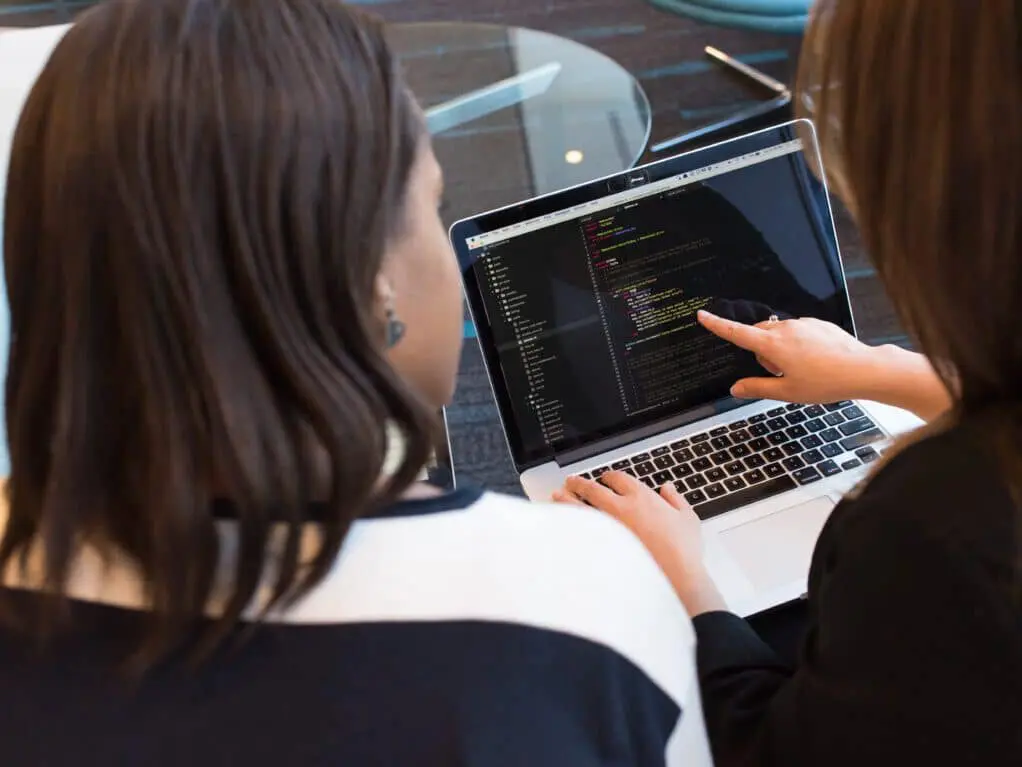 Woman explains something on the computer